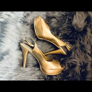 Gold high heels by Nine West Size 7 1/2 used.